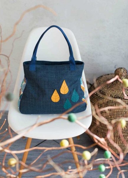 Henkeltasche mit edler Paspel in kurvigem Design