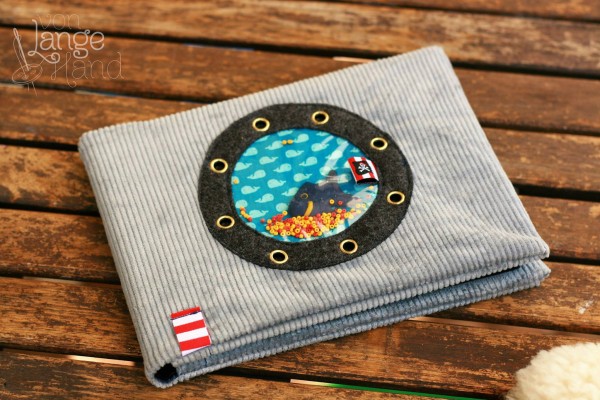 selbstgenähtes Babybuch mit Bullauge